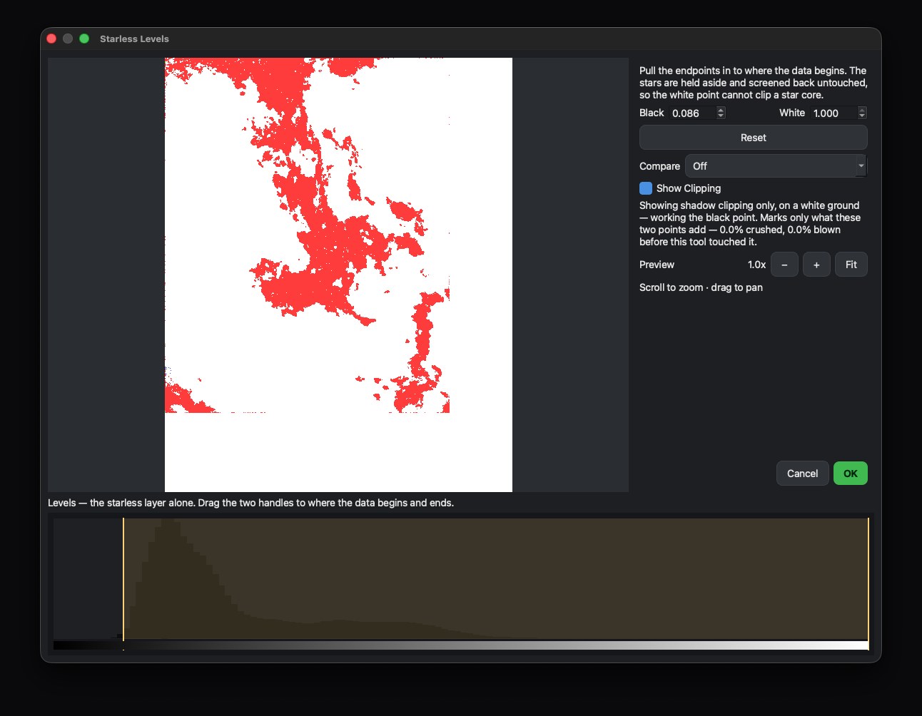 The clipping view while working the black point: the picture is replaced by a white field, and only the pixels being crushed show, coloured by which channel died